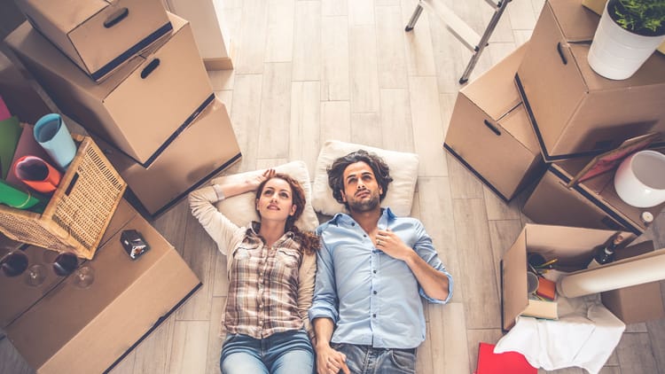 A couple moving out of their house representing rv travel trends 2026